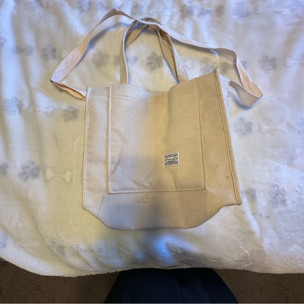 Cream canvas tote bag with adjustable straps